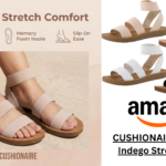 Woman wearing CUSHIONAIRE Indego Stretch Sandal while walking outdoors on a sunny day.
